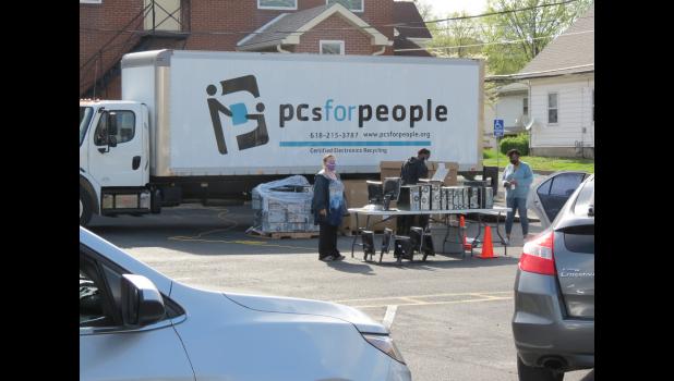 PCs for People and local Girl Scouts helped to distribute computers Thursday afternoon, April 8, at Mt. Moriah Lutheran Church in Anna.