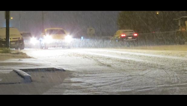 Heavy snow was falling Friday evening, Jan. 11, in the Union County area. The picture was taken near the intersection of South Main and West Davie streets in Anna. At the time, the Union County area was under a winter storm warning which had been issued by the National Weather Service office in Paducah.