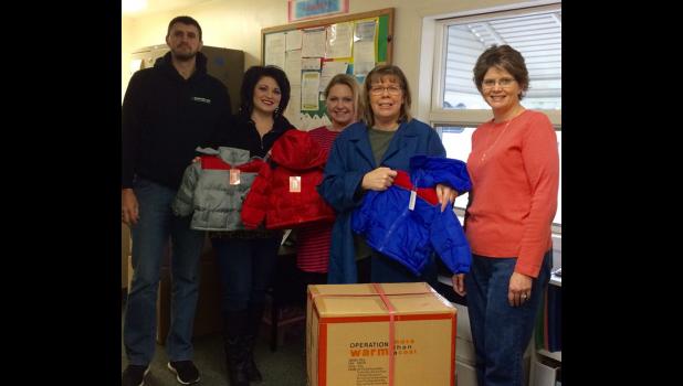 With the help of Shawnee Mass Transit District, SMTD, in Vienna, coats were delivered for Vienna and Goreville Head Starts. From left are SMTD IT specialist Mike Pietrowski, SMTD operations manager Tiffany Ray, Head Start assistant site supervisor and parent coordinator Mandy Wolfe, Head Start coordinator Cheryl Gage and WIBH sales manager Shawnna Rhine. Photo provided.